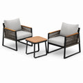 Set de sillas de aluminio negro con cojines grises y mesa redonda