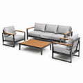 Conjunto de muebles de teca y mimbre con cojines beige